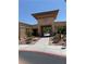 Welcoming community entrance featuring desert landscaping and inviting architecture under a clear blue sky at 2540 Binary Stars St, Henderson, NV 89044