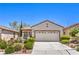Charming single-story home with desert landscaping and a two-car garage at 2540 Binary Stars St, Henderson, NV 89044