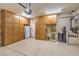 Spacious garage with ample cabinet storage, lighting, and clean epoxy flooring at 2540 Binary Stars St, Henderson, NV 89044