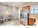 Spacious kitchen area featuring stainless steel refrigerator and tile flooring at 2540 Binary Stars St, Henderson, NV 89044