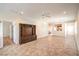 Spacious living room with tile flooring, ceiling fan, and custom wood entertainment center at 2540 Binary Stars St, Henderson, NV 89044