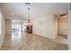 Open floor plan with tile flooring and a vintage light fixture at 2540 Binary Stars St, Henderson, NV 89044
