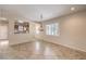 Spacious living room showcasing tile flooring and a passthrough to the kitchen at 2540 Binary Stars St, Henderson, NV 89044