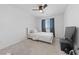 Cozy bedroom with ceiling fan, window and minimalistic furniture providing a relaxing space at 2732 Roman Palm Rd, North Las Vegas, NV 89086