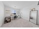 Bright bedroom setup with a desk, shelves, and large mirror, offering versatile space at 2732 Roman Palm Rd, North Las Vegas, NV 89086
