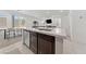 Open-concept kitchen featuring an island, stainless steel appliances, and seamless flow to living areas at 2732 Roman Palm Rd, North Las Vegas, NV 89086