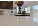 Close-up on a kitchen countertop with a bouquet of flowers, showcasing the quartz countertop at 2732 Roman Palm Rd, North Las Vegas, NV 89086