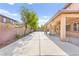 Spacious backyard featuring a large paved area ideal for entertaining or recreation at 2755 Asgard Ave, Las Vegas, NV 89121