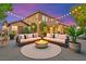 Staged backyard with comfortable seating, a cozy fire pit, and ambient string lights at 2755 Asgard Ave, Las Vegas, NV 89121
