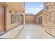 A secluded backyard space features neutral tones and leads to gated entryway at 2755 Asgard Ave, Las Vegas, NV 89121