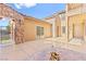 Spacious backyard patio featuring a stone accent wall and private gated access at 2755 Asgard Ave, Las Vegas, NV 89121