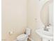 Bathroom view showcasing toilet, sink and oval mirror at 2755 Asgard Ave, Las Vegas, NV 89121