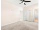Carpeted bedroom with ceiling fan, closet, and adjacent bathroom at 2755 Asgard Ave, Las Vegas, NV 89121