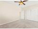 A bright, carpeted bedroom features a ceiling fan and closet for ample storage at 2755 Asgard Ave, Las Vegas, NV 89121