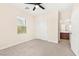 Bright bedroom with ceiling fan, carpeted floors, and ample closet space at 2755 Asgard Ave, Las Vegas, NV 89121