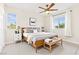 Stylishly staged bedroom with a large bed, lamps, and lots of natural light at 2755 Asgard Ave, Las Vegas, NV 89121
