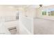 A bonus room with neutral carpeting, ceiling fan, and ample natural light from several windows at 2755 Asgard Ave, Las Vegas, NV 89121