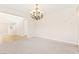 Spacious dining room with a chandelier and an open view of the staircase at 2755 Asgard Ave, Las Vegas, NV 89121