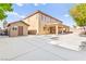 View of the rear exterior highlighting the large concrete lot, shed, and covered patio at 2755 Asgard Ave, Las Vegas, NV 89121