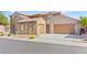 Two-car garage and low maintenance landscaping complement this home's desert curb appeal at 2755 Asgard Ave, Las Vegas, NV 89121