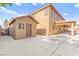 Exterior home view showcasing shed, spacious concrete lot, and covered patio at 2755 Asgard Ave, Las Vegas, NV 89121