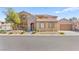 Charming home with a well-maintained front yard and stone accents, offering great curb appeal in a residential neighborhood at 2755 Asgard Ave, Las Vegas, NV 89121