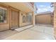 Welcoming front porch area with clean lines, a security system and outdoor seating, inviting visitors with its charm at 2755 Asgard Ave, Las Vegas, NV 89121