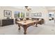 Entertaining game room featuring a pool table, comfortable seating, and tasteful decorations for leisure and recreation at 2755 Asgard Ave, Las Vegas, NV 89121