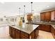 Gourmet kitchen features granite countertops, a central island, and modern cabinetry at 2755 Asgard Ave, Las Vegas, NV 89121