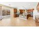 Bright kitchen features an island, stainless steel appliances, and tile flooring at 2755 Asgard Ave, Las Vegas, NV 89121