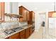 Chef's kitchen features a stainless hood, gas range, and granite countertops at 2755 Asgard Ave, Las Vegas, NV 89121