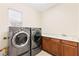 Laundry room featuring washer and dryer, cabinets and sink at 2755 Asgard Ave, Las Vegas, NV 89121