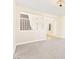 Cozy living room features carpet flooring, neutral paint, and staircase access nearby at 2755 Asgard Ave, Las Vegas, NV 89121