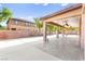Wide covered patio with ceiling fans and ample space for seating and dining at 2755 Asgard Ave, Las Vegas, NV 89121