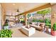 Virtual staging of a covered patio with a cozy seating area and garden at 2755 Asgard Ave, Las Vegas, NV 89121
