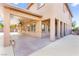 Large covered patio area with ceiling fans, multiple access doors, and a neutral color palette at 2755 Asgard Ave, Las Vegas, NV 89121
