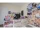 Bedroom with carpet floors, posters on the wall, and lots of decorations at 2856 Trossachs St, Henderson, NV 89044