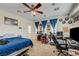 Comfortable bedroom with a ceiling fan, a window with curtains, and carpeted floor at 2856 Trossachs St, Henderson, NV 89044