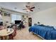 This spacious bedroom features neutral carpet and a ceiling fan at 2856 Trossachs St, Henderson, NV 89044