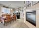 Bright dining area with a cozy table set, fireplace, and access to the living spaces at 2856 Trossachs St, Henderson, NV 89044