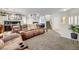 Comfortable living room with neutral tones, plush seating, and a cozy atmosphere at 2856 Trossachs St, Henderson, NV 89044