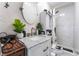 Stylish bathroom featuring marble-like walls, a round mirror, and an elegant vanity at 2990 Carnelian St, Las Vegas, NV 89121