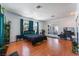 Spacious bedroom featuring wood floors, large windows, and black bedding for a modern aesthetic at 2990 Carnelian St, Las Vegas, NV 89121