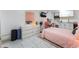 Bedroom featuring light tile floors, neutral walls, and modern furniture with accent lighting at 2990 Carnelian St, Las Vegas, NV 89121