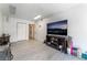 Spacious bonus room featuring hardwood floors, with a large TV, closet and storage at 2990 Carnelian St, Las Vegas, NV 89121