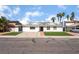 Charming single-story home featuring a well-maintained lawn, updated exterior, and a spacious driveway at 2990 Carnelian St, Las Vegas, NV 89121
