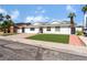 Inviting single-story house showcasing fresh landscaping and a quaint walkway leading to the front door at 2990 Carnelian St, Las Vegas, NV 89121