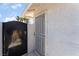 Exterior view showing a black metal gate and security screen door at 2990 Carnelian St, Las Vegas, NV 89121