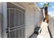 Exterior view showing a screen door and view of the side yard at 2990 Carnelian St, Las Vegas, NV 89121