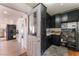 Unique black kitchen with plenty of counter space for prep and a decorative backsplash at 2990 Carnelian St, Las Vegas, NV 89121